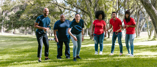 group of adults playing ring toss game